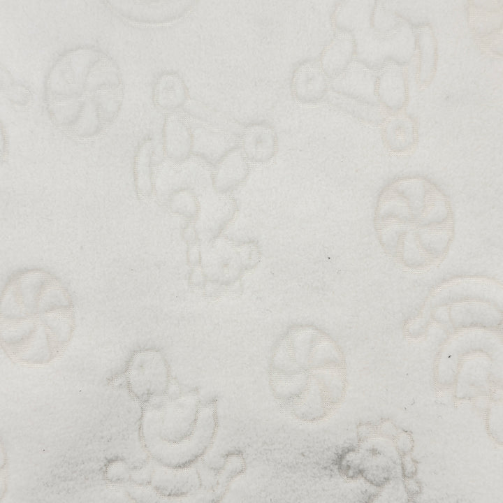 Close-up of rocking horse and duck design on white fleece fabric