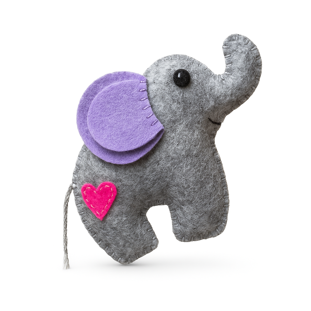 A completed felt elephant craft with gray body, purple ears, and a pink heart on its side.
