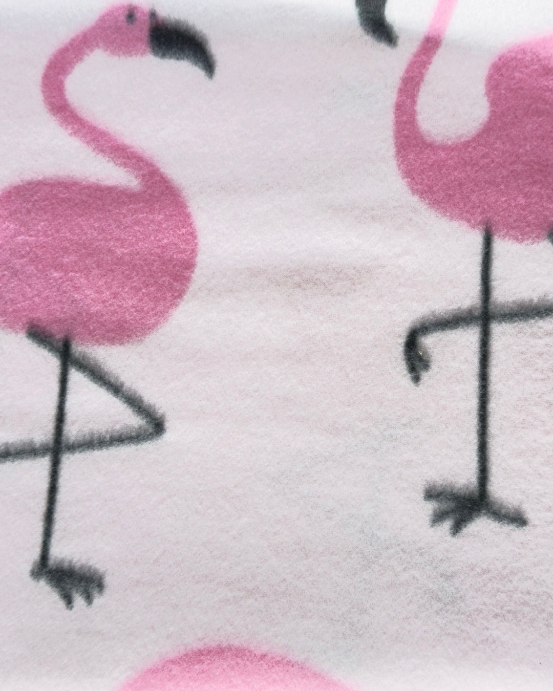 Close-up of pink flamingo pattern on a white background