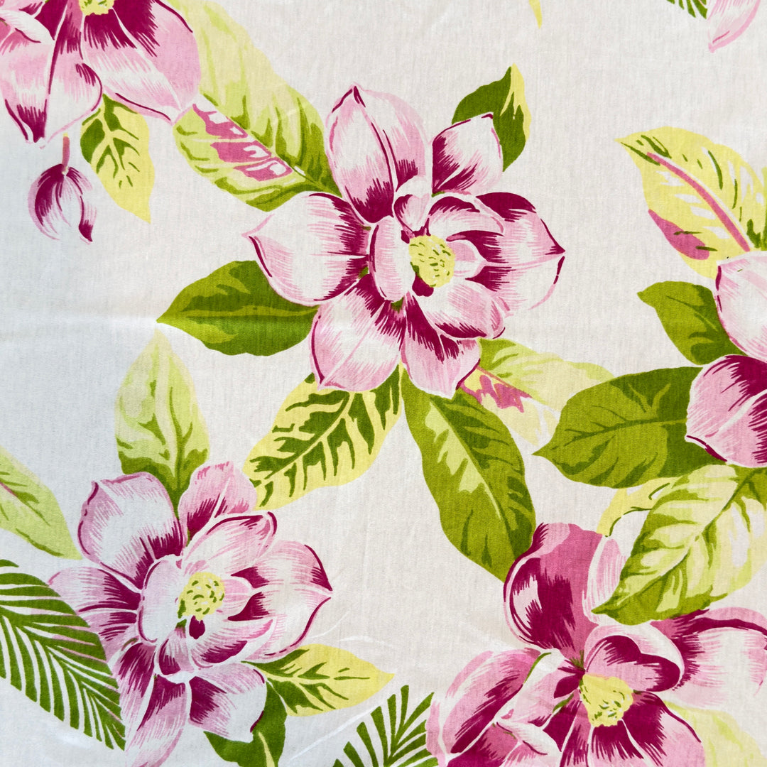 Floral pattern with pink flowers and green leaves on a white background