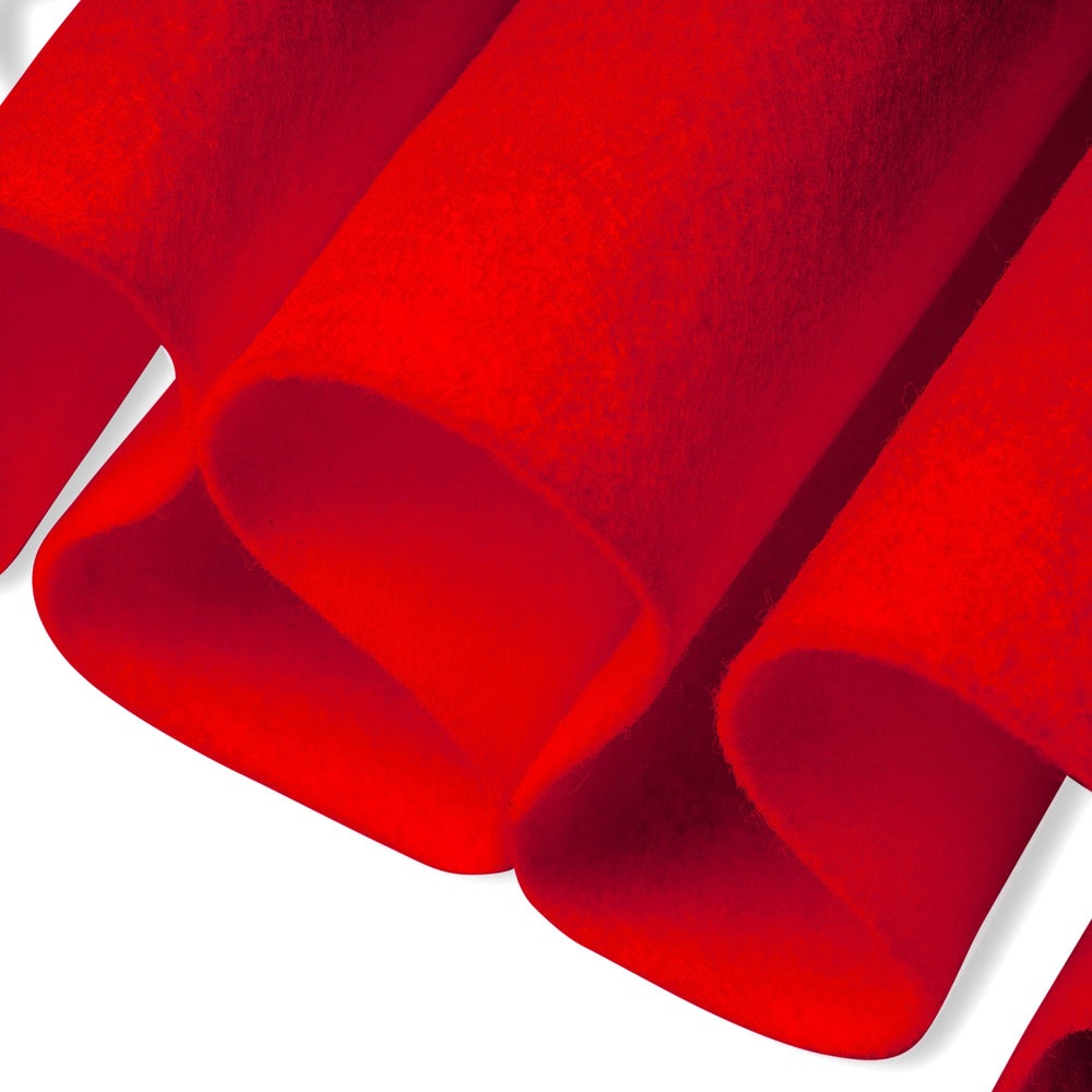 Close-up of hot orange color fabric with a textured surface