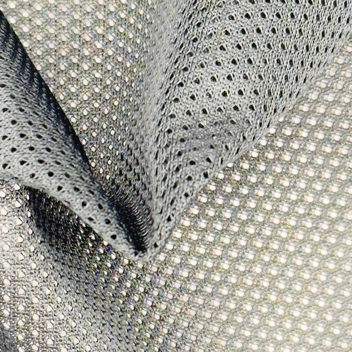 Flat texture view of black polyester micro mesh fabric showing fine perforated pattern