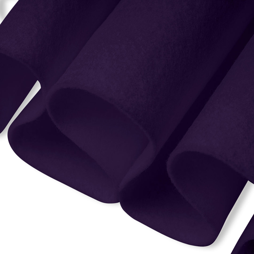 Close-up of dark purple fabric on a white background