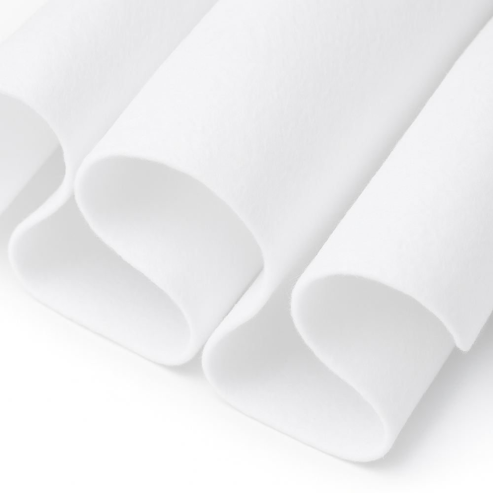 Close-up of White felt fabric with a white background