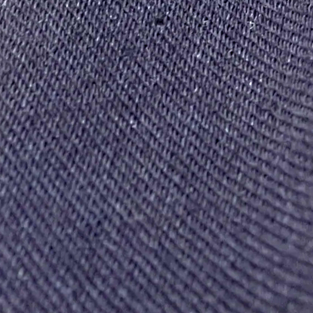 Close-up of dark navy 4-way stretch denim twill weave