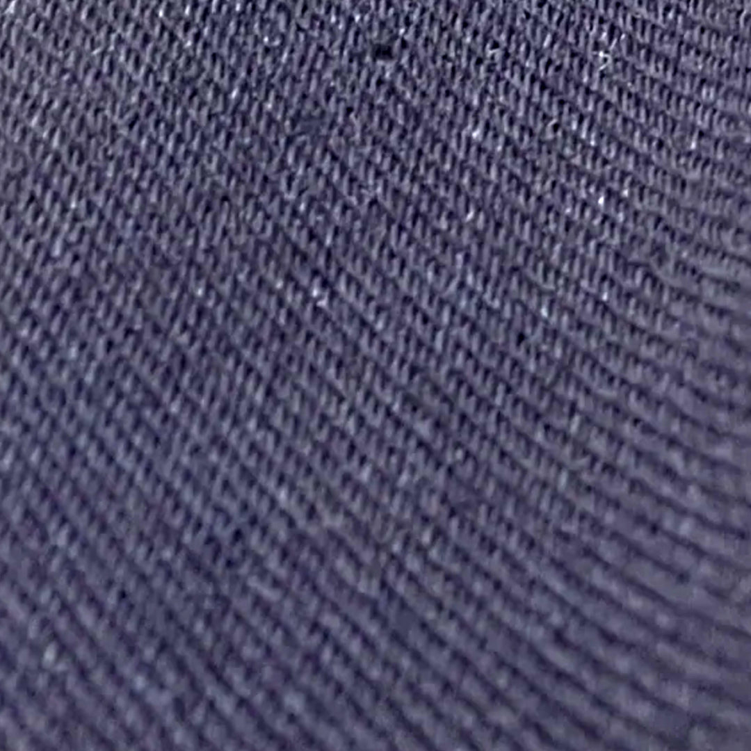 Close-up of dark navy 4-way stretch denim twill weave