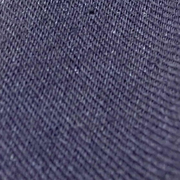 Close-up of dark navy 4-way stretch denim twill weave