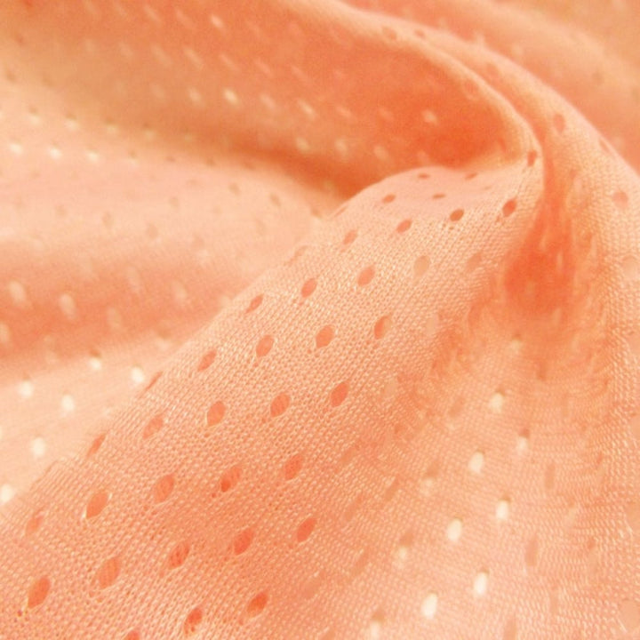 Football Mesh fabric in Peach, 100% polyester, sold by the yard