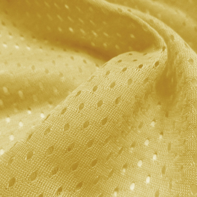 Football Mesh fabric in Vegas Gold, 100% polyester, sold by the yard
