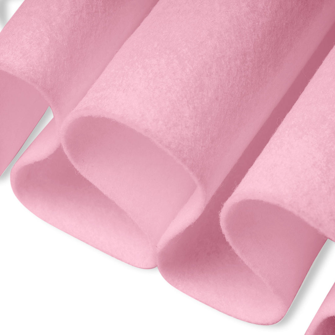 Close-up of pink textured fabric with a white background