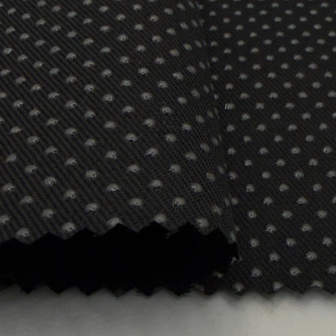 Close-up of silicone dot anti-slip fabric in black, showcasing the textured non slip fabric surface for better grip.