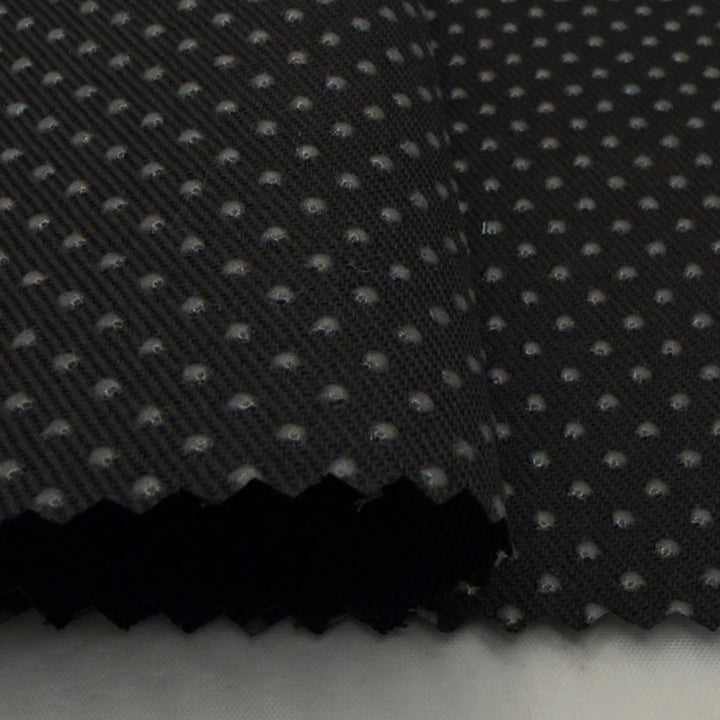 Close-up of silicone dot anti-slip fabric in black, showcasing the textured non slip fabric surface for better grip.