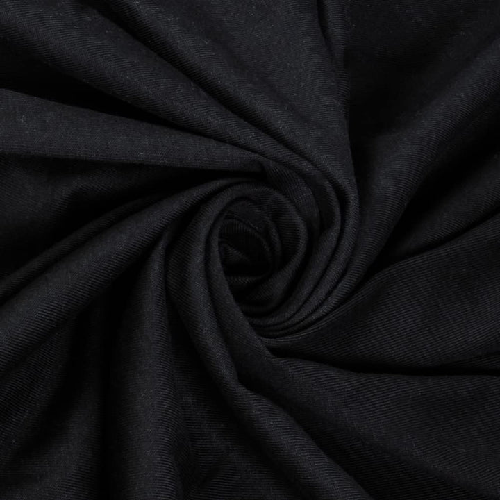 Close-up of Black organic jersey knit fabric with a swirl pattern