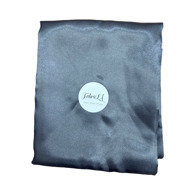 Satin fabric by the yard in a luxurious gray color, showcasing a smooth and shiny finish, perfect for various projects.