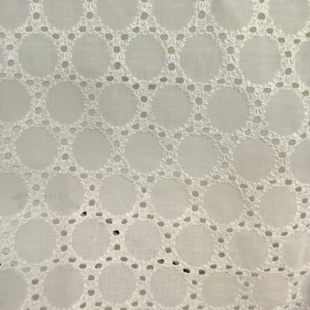 Close-up of a textured fabric with a geometric pattern on a gray background