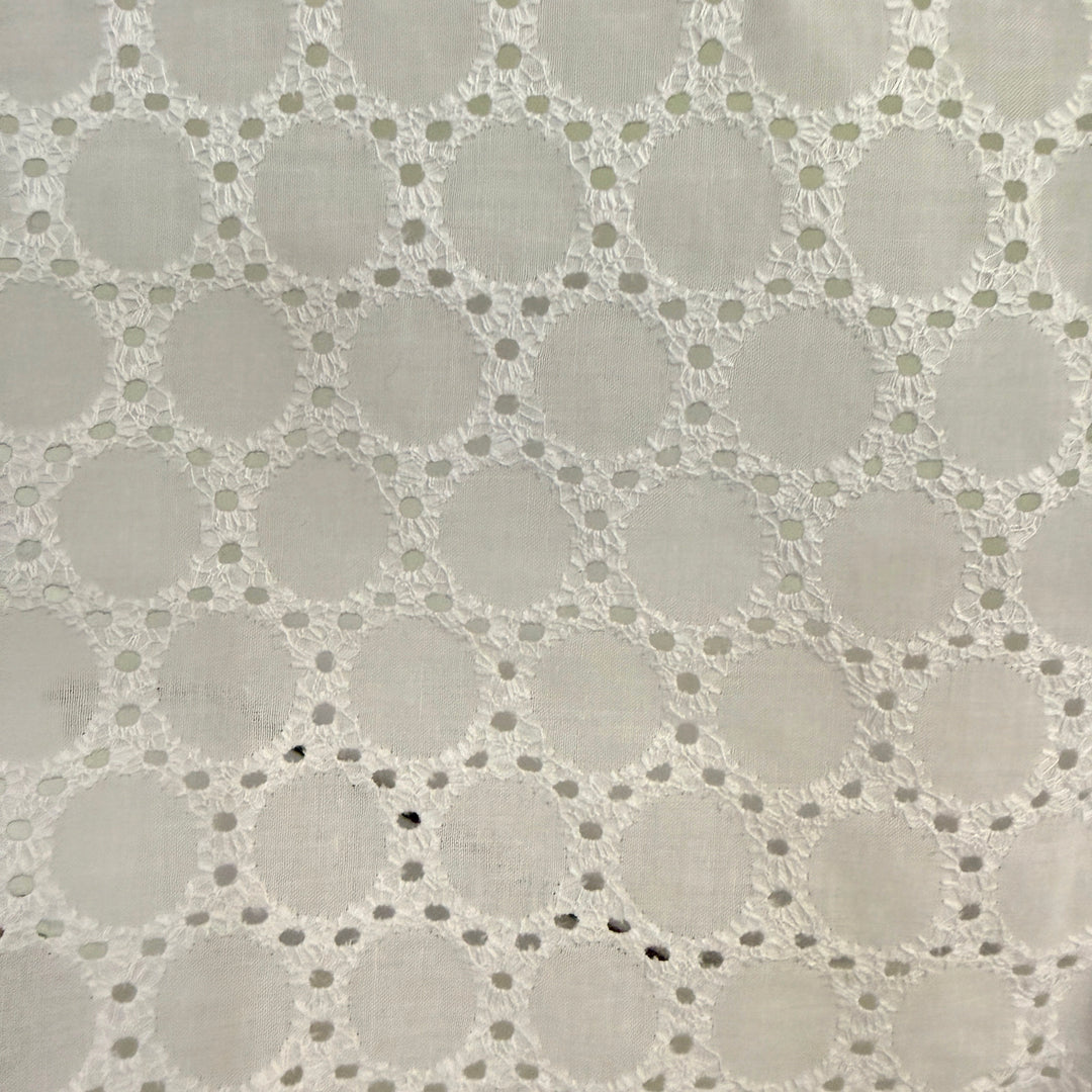 Close-up of a textured fabric with a geometric pattern on a gray background