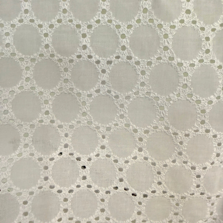 Close-up of a textured fabric with a geometric pattern on a gray background