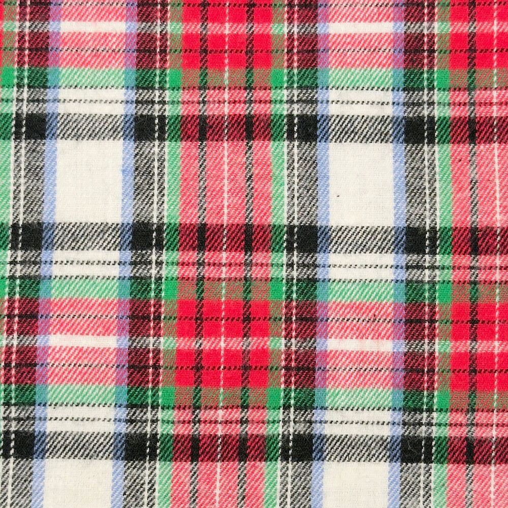 Plaid pattern with red, green, black, and white colors on a fabric background