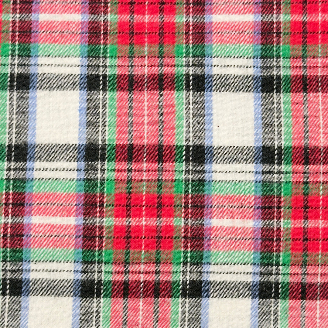 Plaid pattern with red, green, black, and white colors on a fabric background