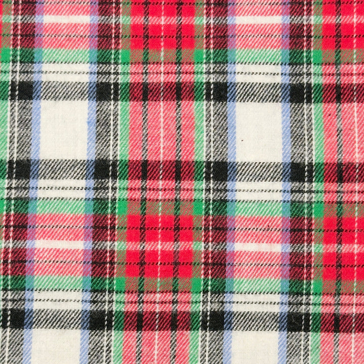 Plaid pattern with red, green, black, and white colors on a fabric background