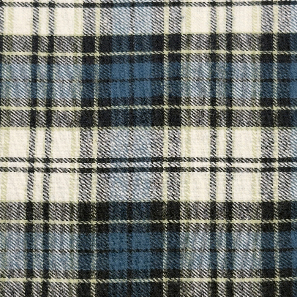 Close-up of a plaid fabric with navy, white, and blue patterns.