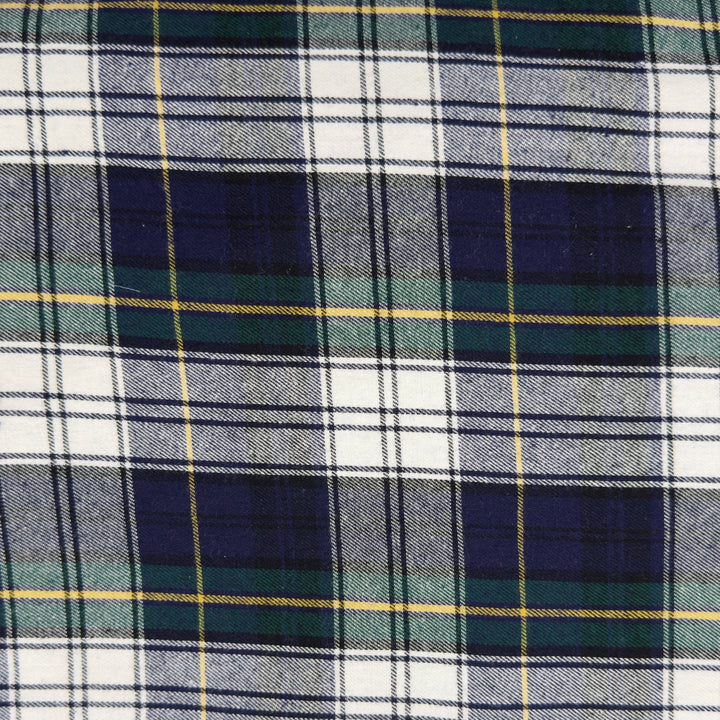 Close-up of plaid fabric with blue, green, and white colors.