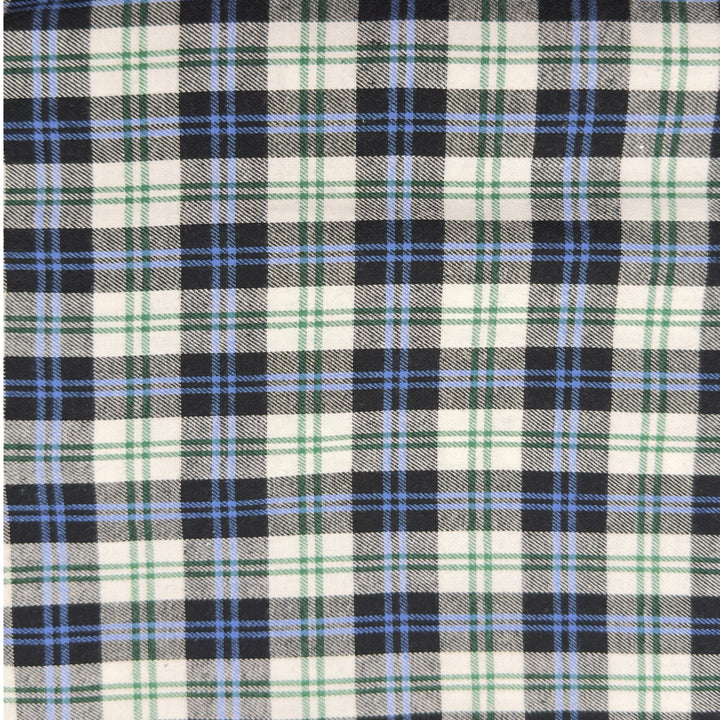 Close-up of a plaid fabric with black, blue, and green pattern.