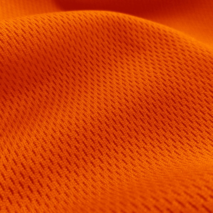 Dimple Mesh (Bird's Eye) fabric in Orange, sold by the yard