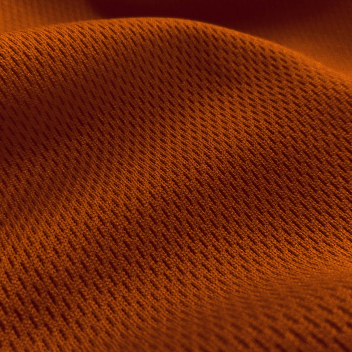 Dimple Mesh (Bird's Eye) fabric in Texas Orange, sold by the yard