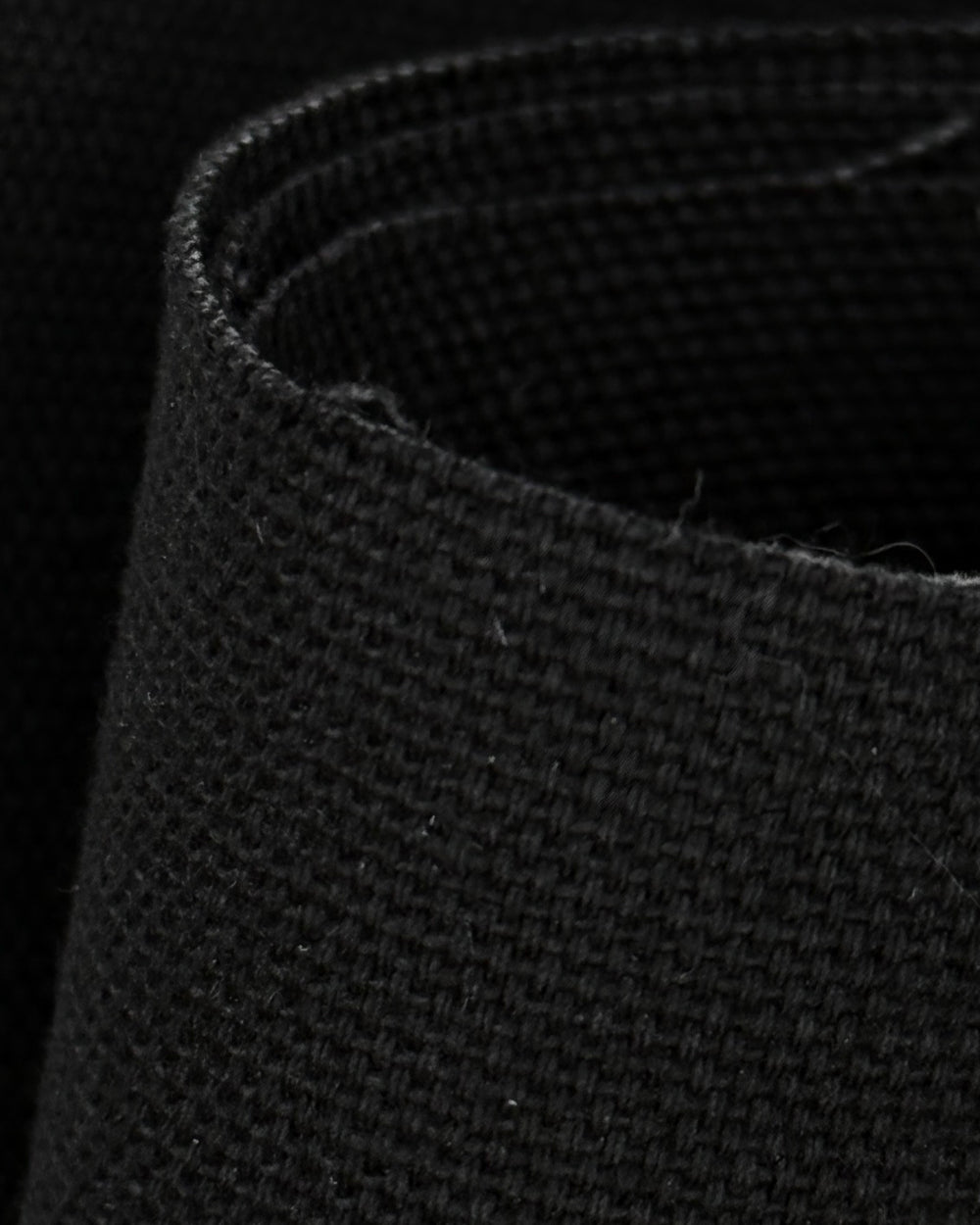 Black 10 oz cotton duck canvas fabric close-up