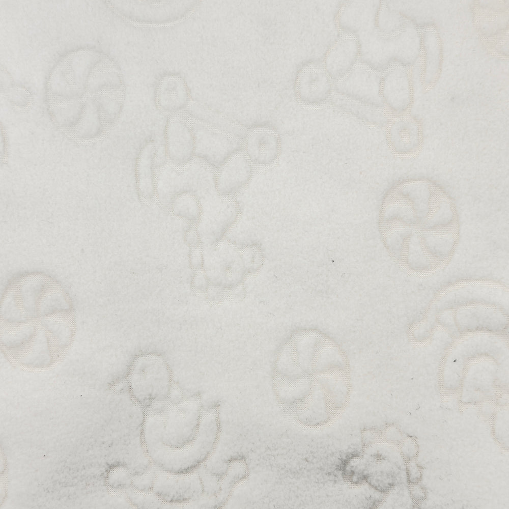 Close-up of rocking horse and duck design on white fleece fabric