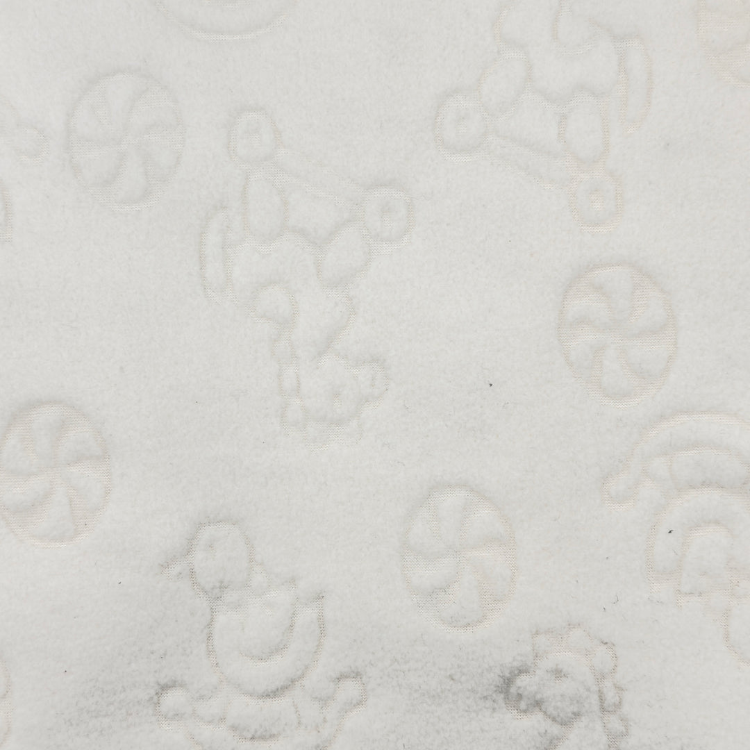 Close-up of rocking horse and duck design on white fleece fabric