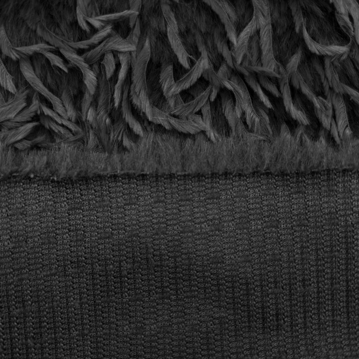 Close-up of feather mink faux fur fabric showing soft black texture and plush strands for sewing projects.