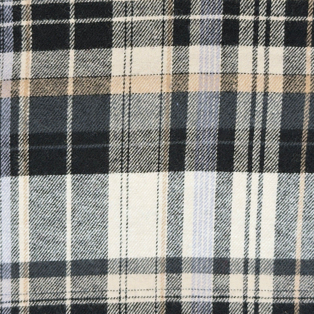 Close-up of a plaid fabric with black, white, and beige colors.