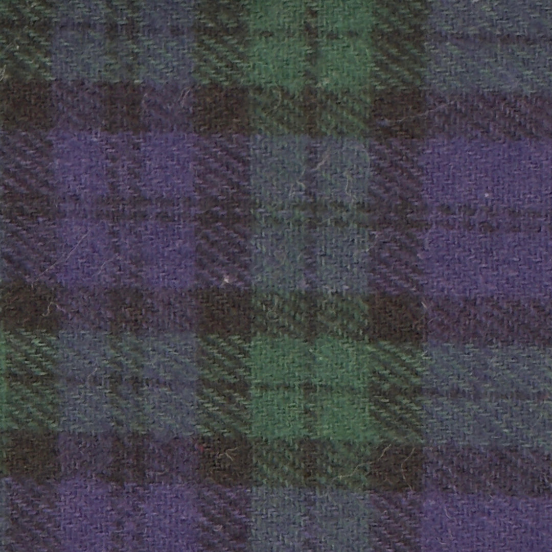 Close-up of a fabric with a plaid pattern in green and purple.