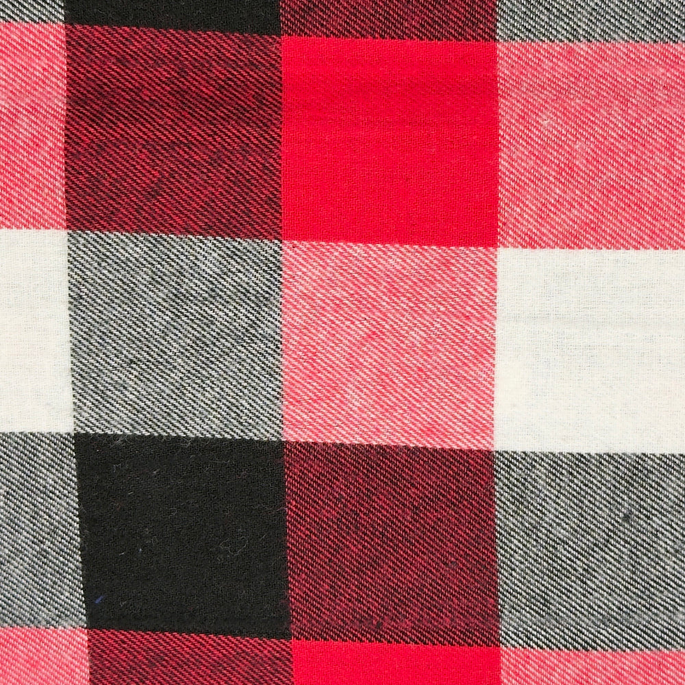 Close-up of a checkered fabric with red, black, and white squares.