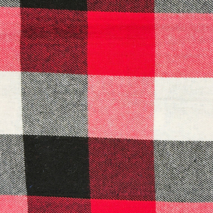 Close-up of a checkered fabric with red, black, and white squares.
