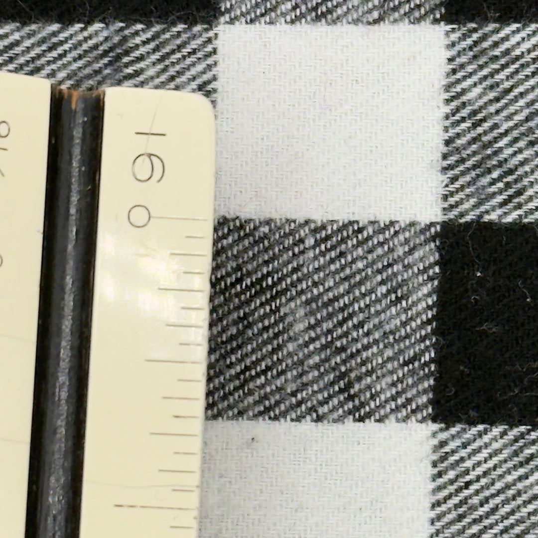 Black and white checkered fabric with a ruler for scale