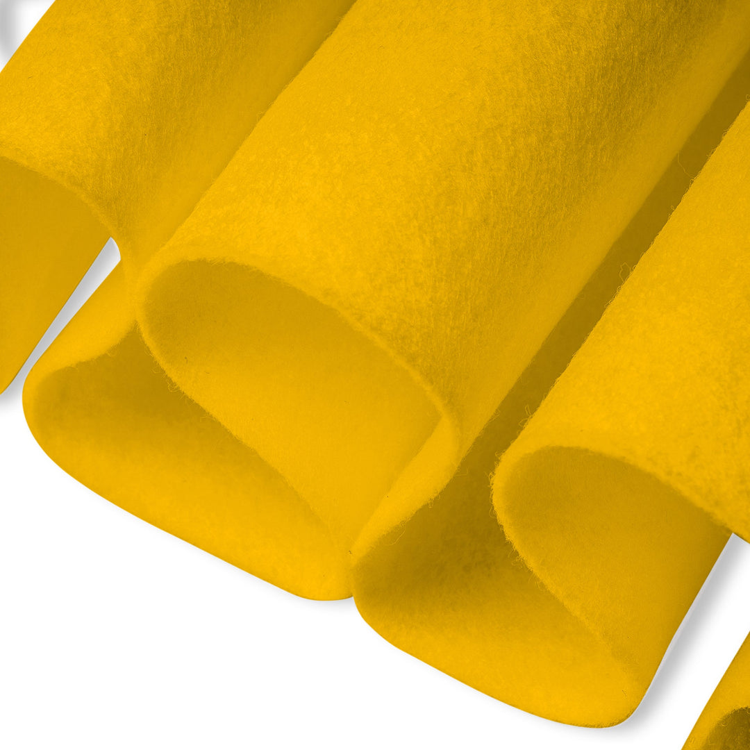 Close-up of yellow textured felt fabric with a white background