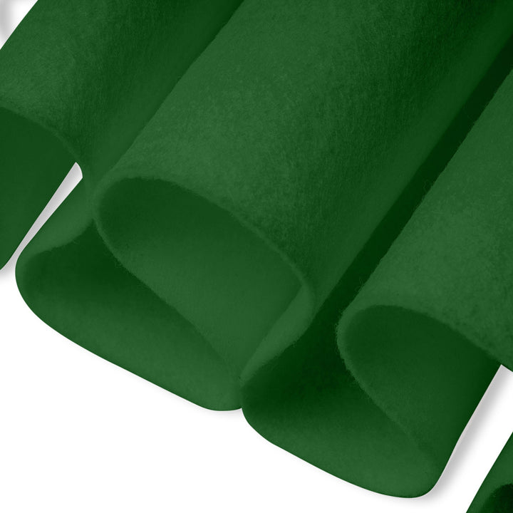 Roll of green felt fabric on a white background