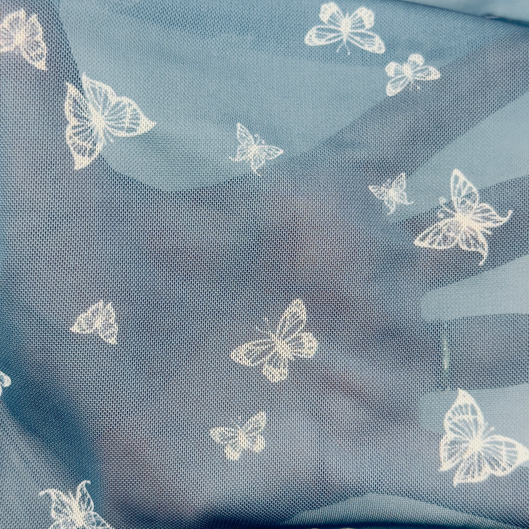 Nylon spandex fabric with chambray butterfly pattern on power mesh, ideal for stylish activewear.