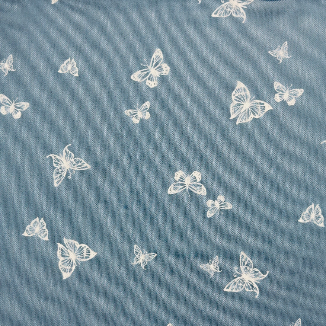 Nylon spandex fabric design featuring white butterflies on a blue background, perfect for stylish garments.