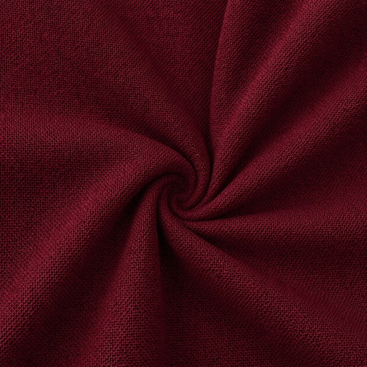 Rayon challis fabric by the yard in a rich burgundy color, showcasing its soft and lightweight texture.