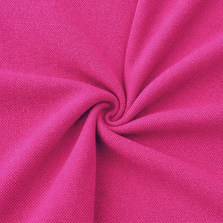 Close-up of vibrant pink rayon challis fabric by the yard, showcasing its soft and lightweight texture.