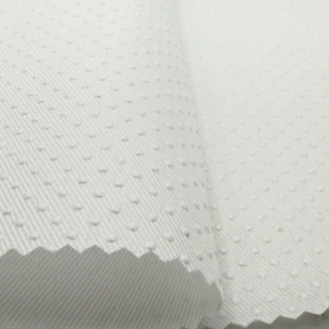Silicone dot anti-slip fabric in white, non slip fabric with textured grip for stability in sewing and upholstery projects.