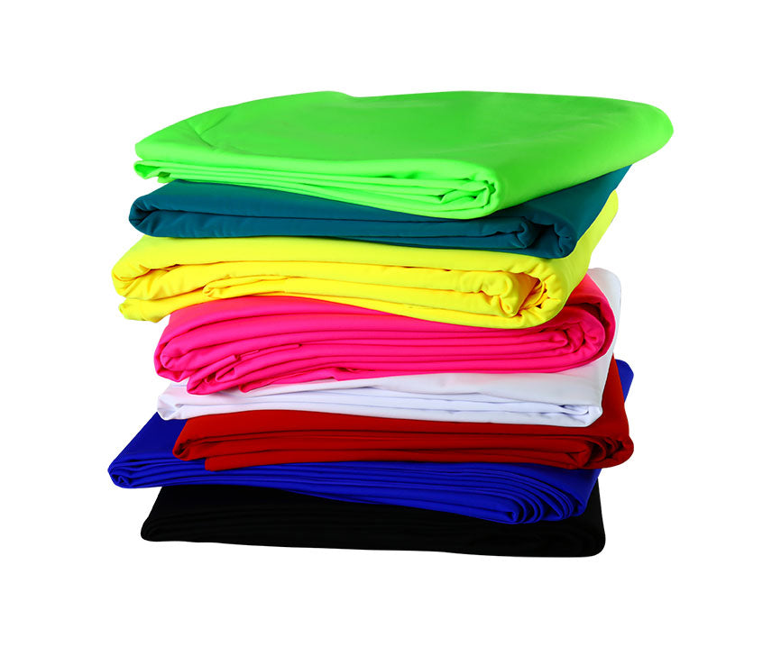 Swimwear knit fabrics piled up on each other.
