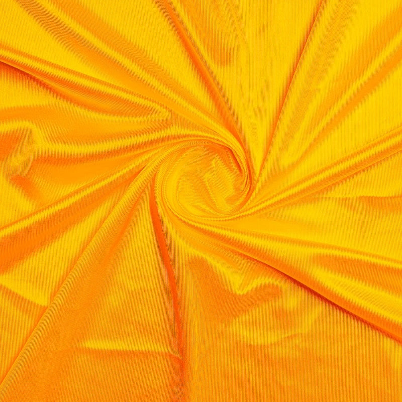 Athletic Dazzle Polyester fabric in Gold, sold by the yard