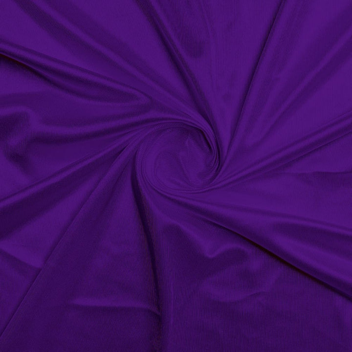Athletic Dazzle Polyester fabric in Purple, sold by the yard