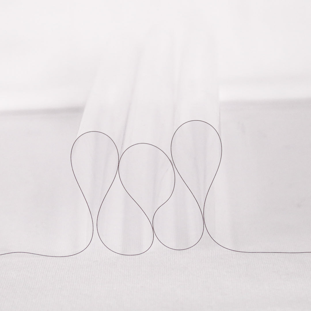 12 gauge clear vinyl fabric draped to show light flexible transparency | FabricLA
