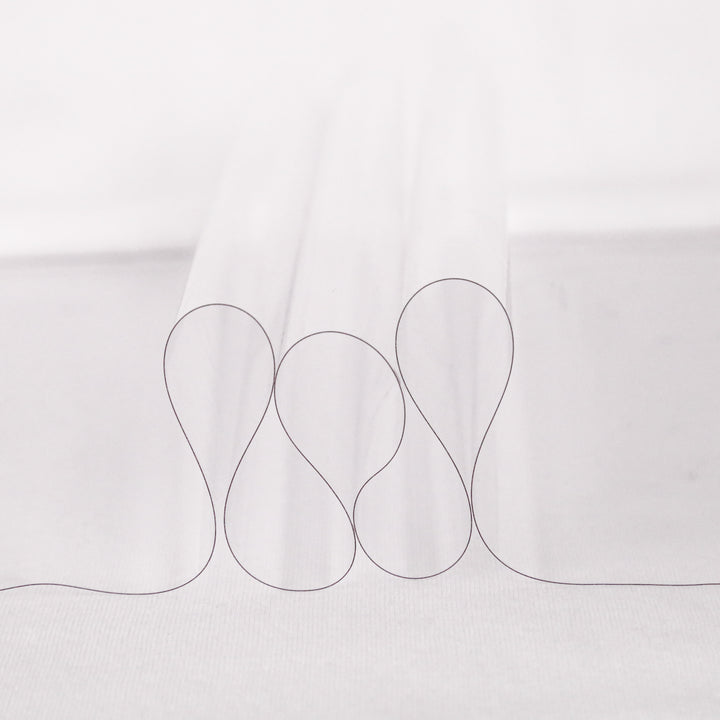 12 gauge clear vinyl fabric draped to show light flexible transparency | FabricLA